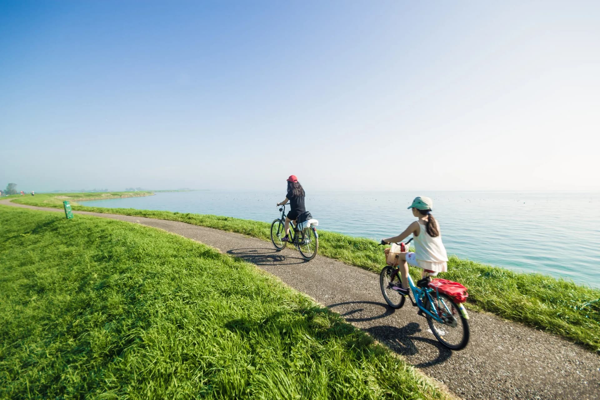 Kids riding bikes on summer day
