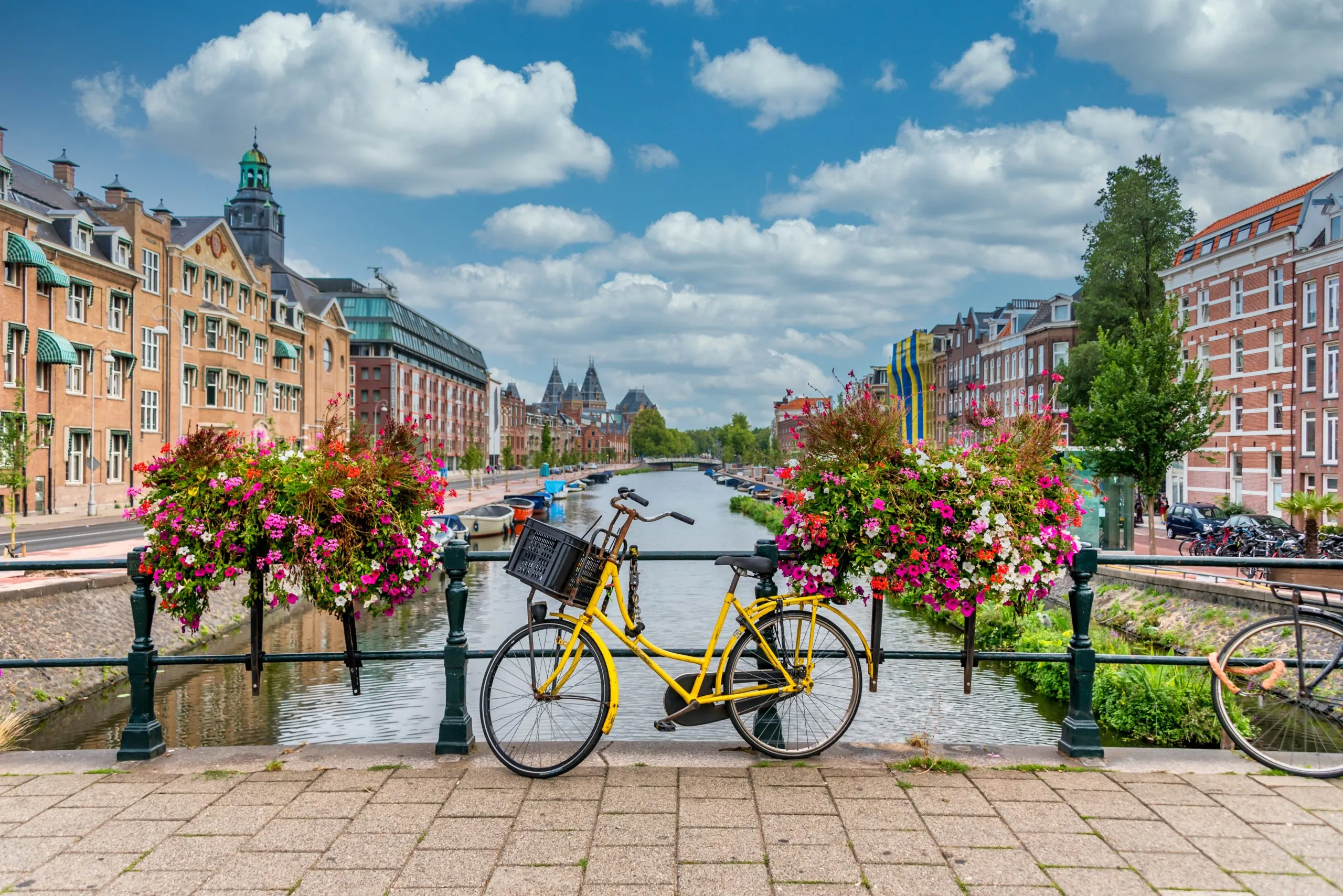 Bicycle on a Bridge over a Canal in Amsterdam Netherlands with Blue Sky